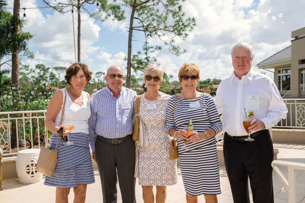 Group of five guests standing outside at Naples 2019